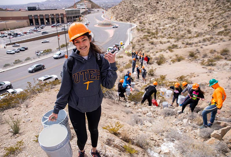 The 'Mining Minds' pickaxe sculpture at the Sun Bowl-University Roundabout will be illuminated in blue and orange Friday evening, March 13, 2020, in honor of TCM Day, The University of Texas at El Paso's longest-running tradition. Photo: JR Hernandez / UTEP Communications 