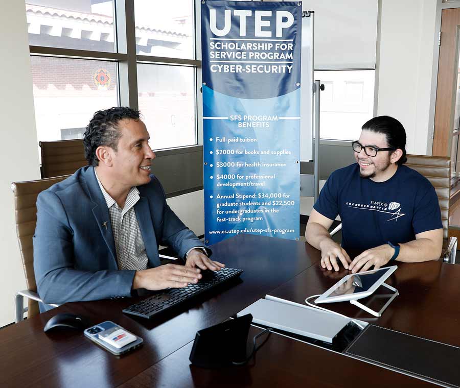 The University of Texas at El Paso will enhance the capacity of the regional and national cybersecurity workforce, thanks to a a $4 million grant from the National Science Foundation and the Department of Homeland Security in support of the CyberCorps Scholarship for Service (SFS) program. Salamah Salamah, Ph.D., associate professor and chair of UTEP’s Department of Computer Science, left, oversees the program and is seen here counseling David Reyes, a doctoral candidate who has been part of the SFS program since its inception. Photo: Laura Trejo/UTEP Marketing and Communications. 