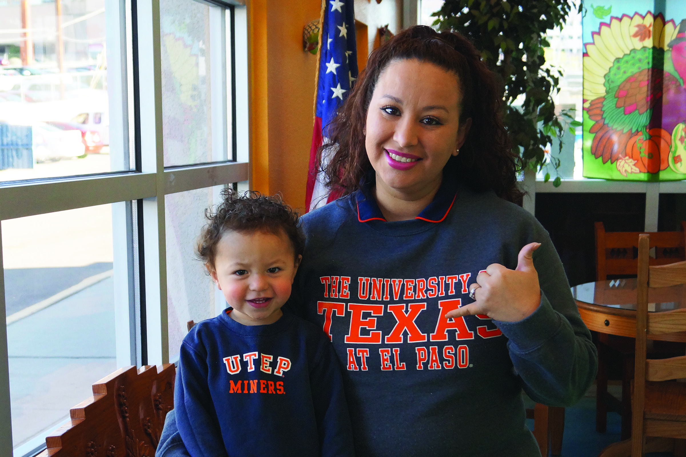 Student and Child in UTEP Gear