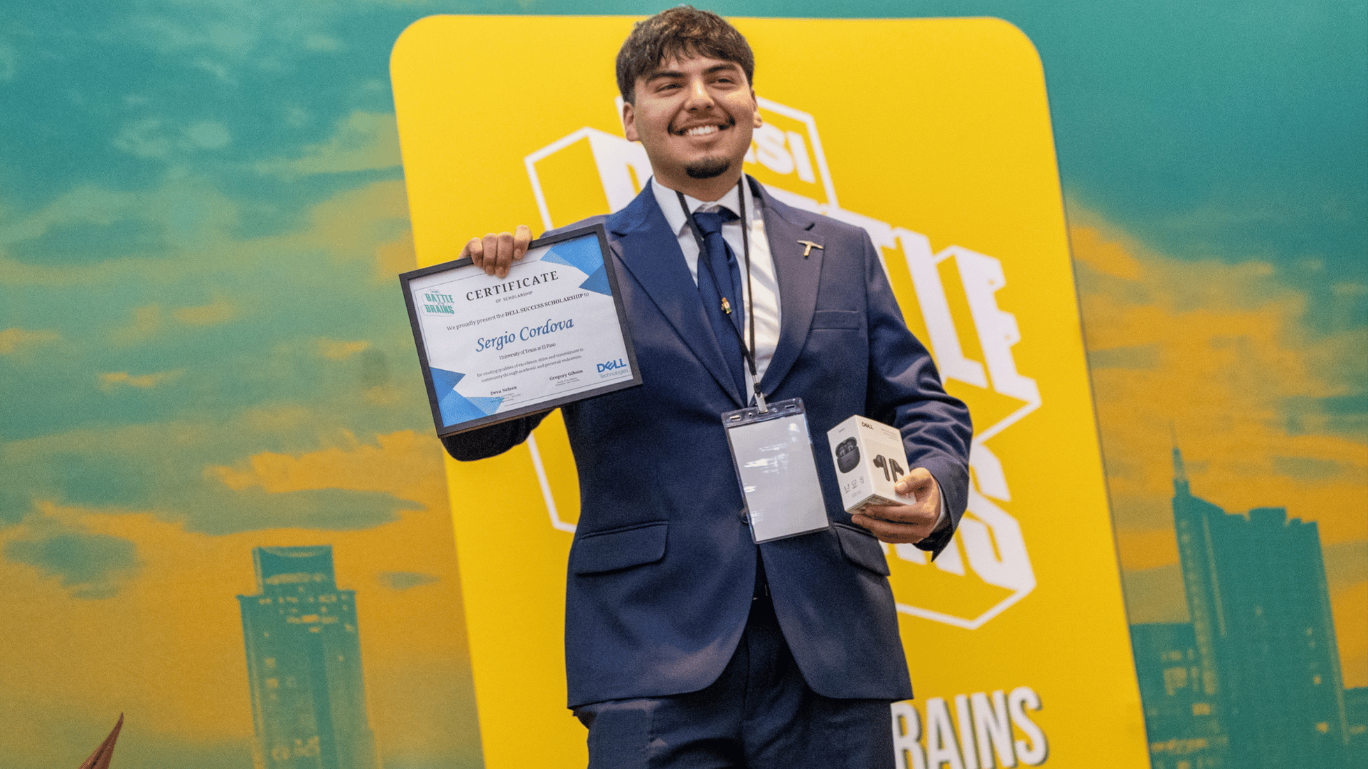 Sergio Cordova holds a scholarship certificate at the 2026 HSI Battle of the Brains competition.