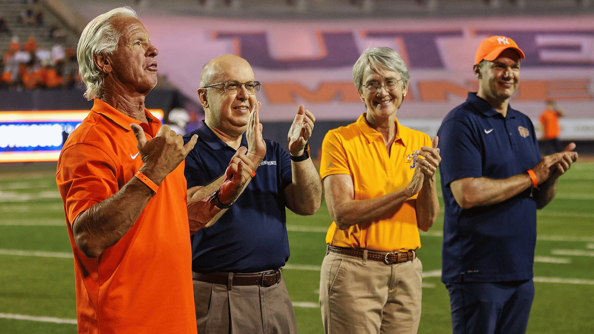 UTEP alumni and university leaders applaud during the 2026 Homecoming football game.