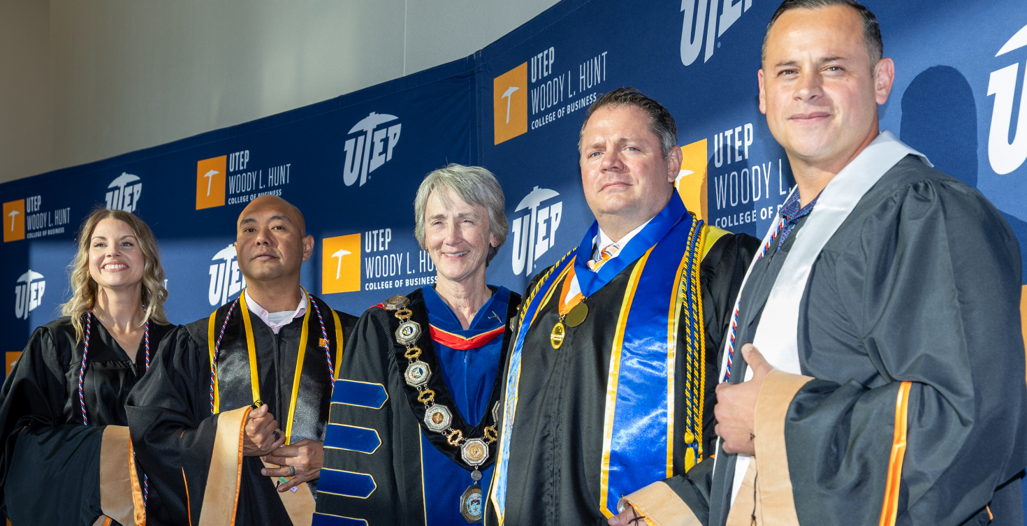 Executive MBA military-connected graduates and UTEP leaders at a hooding ceremony