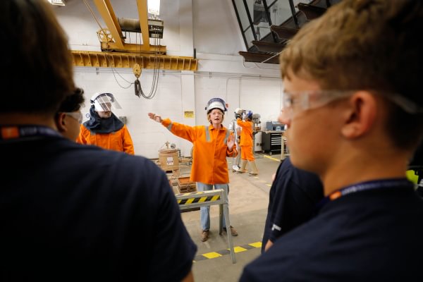 Mining Camp students watching an indoor mining safety demonstration.