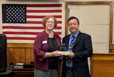 Trish B. Smith, Executive Director of the Texas Society of Professional Engineers presented the award to Carlos Chang, Ph.D., at the NSPE-Tx meeting in El Paso.