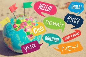 Globe on beach with many languages