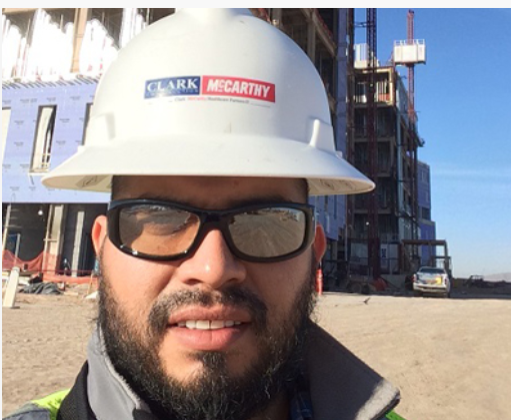 Nathanael Rodriguez, construction management student. A man wearing safety goggles and a hard hat in a construction zone.