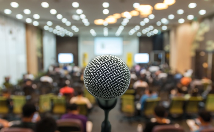 Image of hall with microphone in foreground