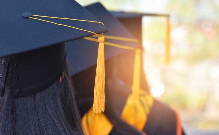 Graduating students in caps and gowns