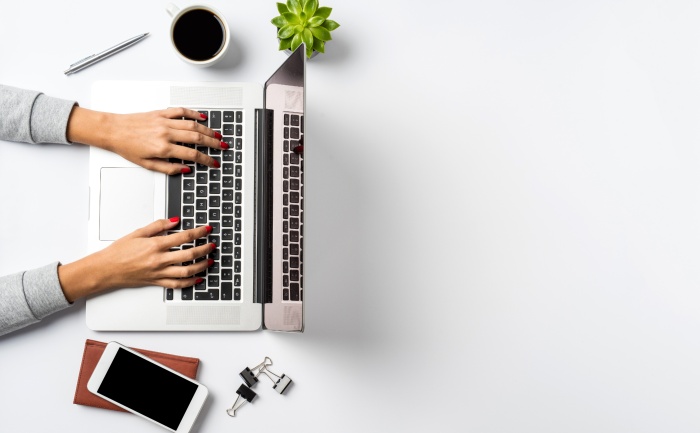 A person working on a laptop computer | Is online education as effective as traditional on-campus schooling | UTEP Connect