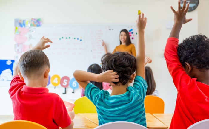 Elementary school teacher and her students in the classroom | Early Childhood Education Master’s Degree | UTEP Connect 