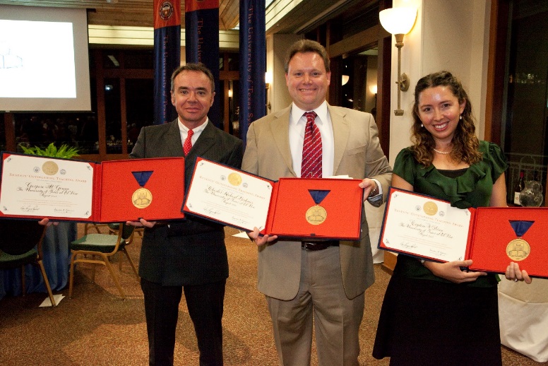 Dr. Gaspare M. Genna, Dr. Charles Boehmer, and Dr. Cigdem Sirin in Austin receiving their awards.