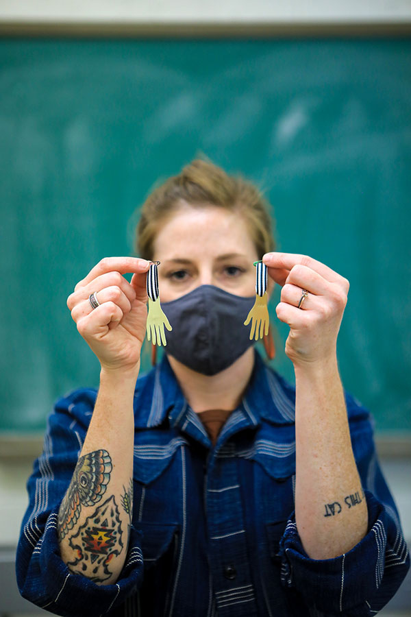Jess Tolbert, assistant professor of art at The University of Texas at El Paso and head of the art department’s jewelry and metals program, leads the region's efforts in the Hand Medal Project, a collaboration of more than 3,000 artists from 66 countries to honor health care workers who risk their lives daily in service to COVID-19 patients. Photo: JR Hernandez / UTEP Communications