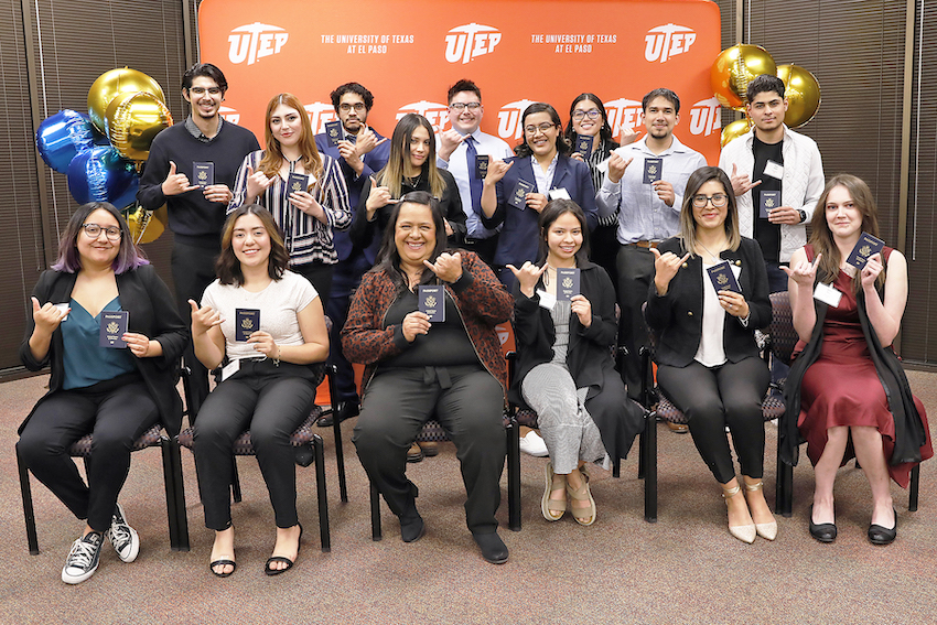 Fifteen of the 27 students selected for UTEP's first Passport Grant received their passport books at an event March 8, 2022. The Office of International Programs/Study Abroad started the Passport Grant program to address a  need among some students for financial assistance to purchase their passports. Photo: Laura Trejo / UTEP Marketing and Communications 