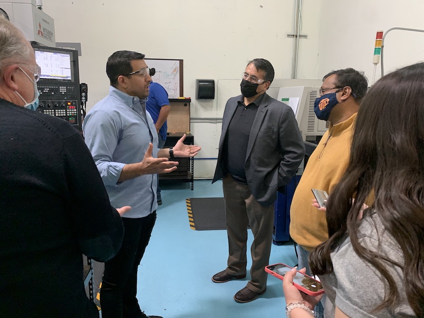 Raul Saenz, owner of Noormac Machining, left, discusses his company with El Paso City Representative Henry Rivera, center, and Ahsan Choudhuri, Ph.D., associate vice president of UTEP's Aerospace Center. Courtesy photo from UTEP's Aerospace Center 