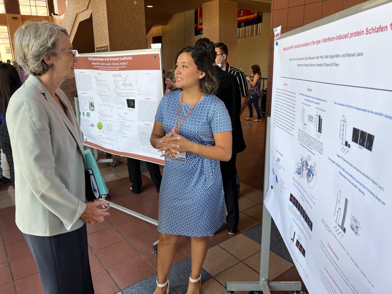 Michelle Pineda presents her research to President Heather Wilson at the Campus Office of Undergraduate Research Initiatives (COURI) Summer Symposium Aug. 6, 2022, in the Undergraduate Learning Center. This event gives undergraduate researchers, scholars and artists the chance to present their work in four categories: arts, humanities and social sciences; life and biomedical sciences; physical sciences; and engineering, computational and applied sciences. 