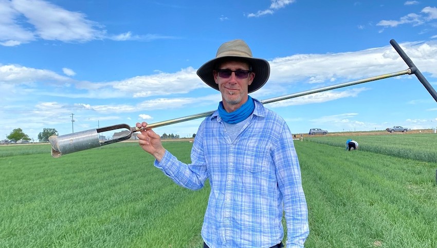 David Huber, Ph.D., poses for a photo while collecting soil carbon samples from a winter wheat field near Kimberly, Idaho – one of the areas included in the project. Photo credit: Tanzila Hanif 