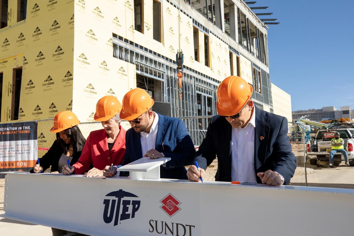 Today, officials from The University of Texas at El Paso and Sundt Construction celebrated a major milestone in the dvanced Manufacturing and Aerospace Center building’s progress — the Topping Out Ceremony.  Officials including, (from left) UTEP Student Government Association President Andrea Nunez, President Heather Wilson, Sundt Project Manager Daren Mieles and Sundt Vice President Joseph Riccillo, signed a construction beam at today's ceremony. 