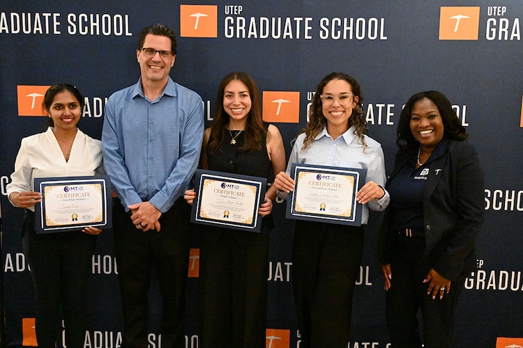 UTEP Graduate School Dean Stephen Crites, Ph.D., and Graduate School Assistant Director of Student Support Crystal Bright, Ph.D., celebrate with the winners of this year’s Three Minute Thesis competition, or 3MT. They are, from left, Soumya Nair, Janine Hagar and Valentina Sanchez-Castano. 