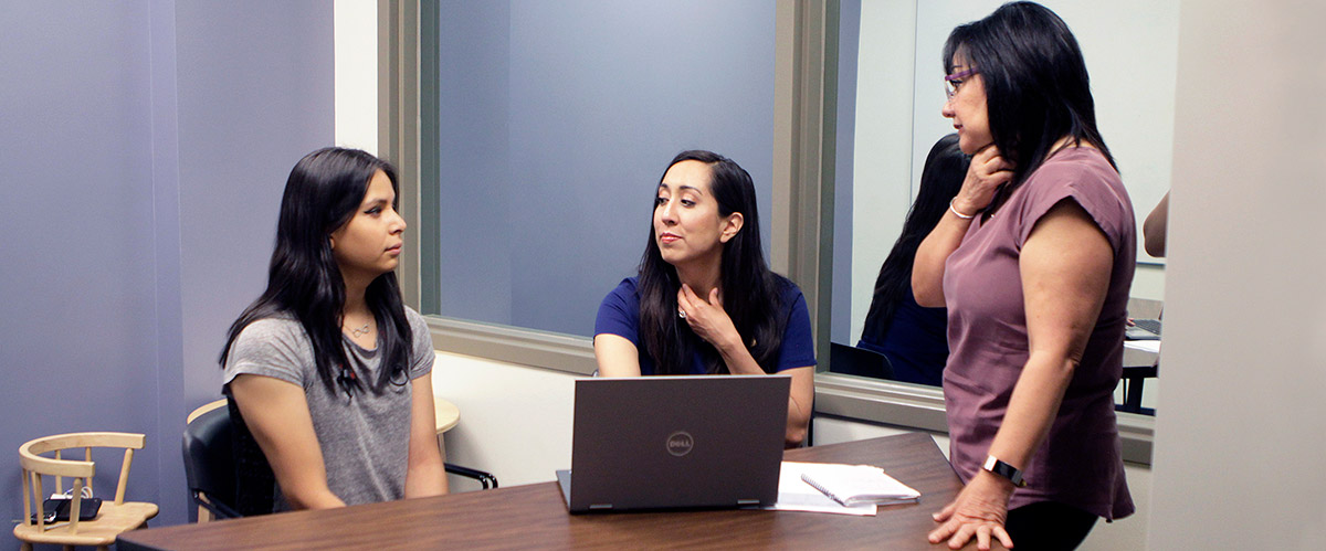 April Gutierrez, center, and Patricia Lara, Ph.D., right, conduct vocal modification exercises for Andi Tiscareño, left, at UTEP’s voice modification clinic for transgender individuals. The service is provided by 16 graduate students from UTEP’s speech language pathology (SLP) program who work with Lara, director of UTEP’s Voice Brain and Language Lab. Photo: Laura Trejo / UTEP Communications