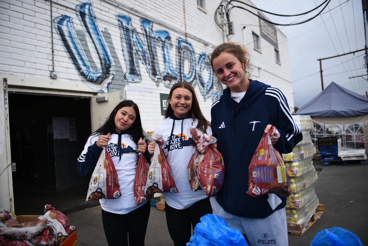 UTEP has once again earned the 2026 Carnegie Community Engagement Classification for its continued and measurable impact across the Paso del Norte region. Pictured: UTEP students help hand out food to community members at the Kelly Center for Hunger Relief. 