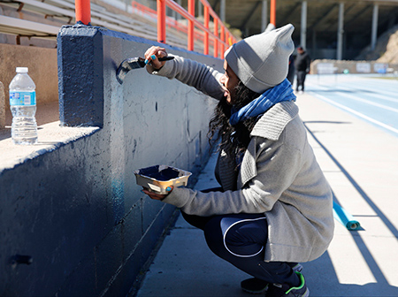Student-athletes and staff for the UTEP track and field team volunteer to clean out the storage area and paint parts of Kidd Field during Project MOVE, the annual day of community service in El Paso on Saturday, February 28, 2015. Photo by Ivan Pierre Aguirre/UTEP Communications 