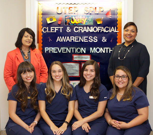 UTEP Speech-Language Pathology students, seated from left, Lisa Valles, Ashlyn Perry, Stephanie Escobar and Magda Alvarado Mena, are participants in a new specialty clinical rotation at the El Paso Cleft Lip and Palate Clinic that started this summer. With them are clinical supervisors Karin De La Fuente, right, and Gloria Macias-DeFrance. Photo: Laura Trejo / UTEP Communications 