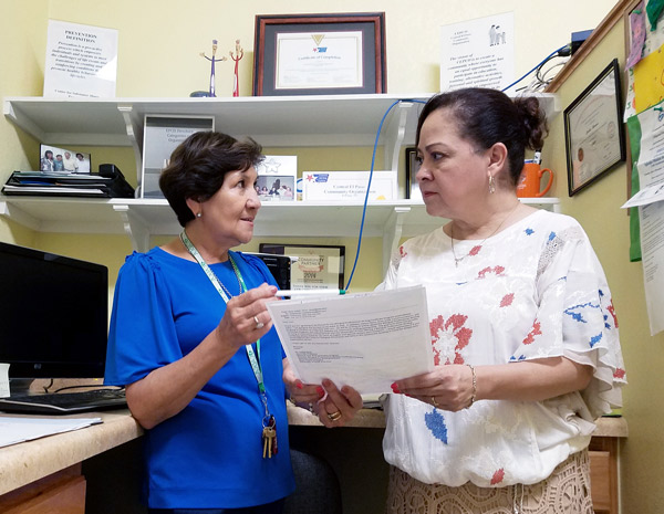 Ceci Herrera, director of the Central El Paso Community Organization, left, discusses center programming with Isabel Baca, Ph.D., associate professor of English and principal investigator of the Bilingual Professional Writing Certificate, one of three new UTEP certificate programs to launch during the fall 2018 semester. Photo: Daniel Perez / UTEP Communications 