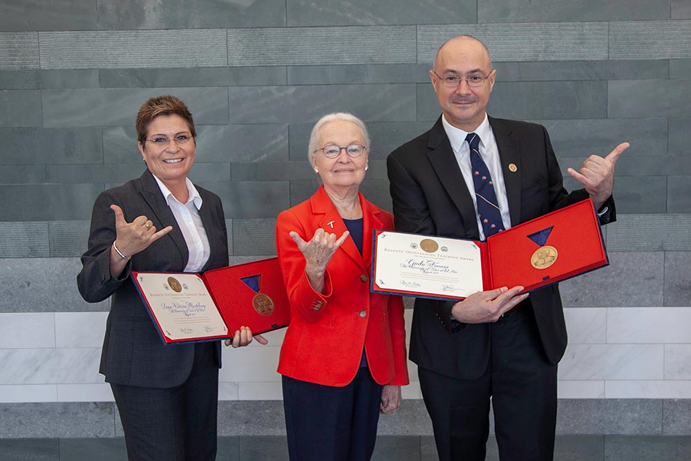 Irma Montelongo, Ph.D., associate professor of practice/online program coordinator for Chicano Studies, left, and Giulio Francia, Ph.D., assistant professor of biological sciences, right, stand with UTEP President Diana Natalicio on Aug. 9, 2018, during a ceremony in Austin, Texas. Montelongo and Francia were named recipients of The University of Texas System Board of Regents’ 2018 Outstanding Teaching Awards (ROTA). Photo: Beverly Barrett 