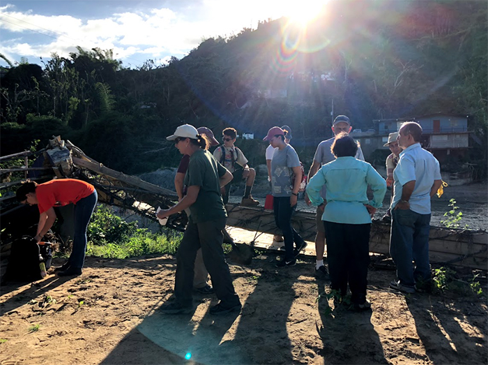 Students from Engineers for a Sustainable World (ESW), a student group from The University of Texas at El Paso's College of Engineering, asses damage done to a suspension bridge in Utuado, Puerto Rico, in this January photo. The bridge was destroyed in the aftermath of Hurricane Maria in September 2017. Students from UTEP and New Mexico State University student group Aggies Without Limits partnered to help rebuild the bridge as part of a relief effort led by Ivonne Santiago, Ph.D., clinical professor in UTEP's Department of Civil Engineering. Photo: Courtesy 