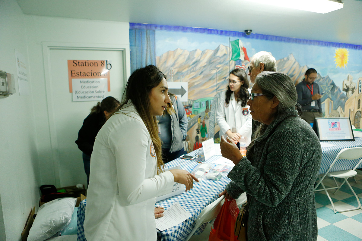 Sarah Jallad, a UTEP School of Pharmacy student, assists Hortensia Castro at the H.O.P.E. clinic Oct. 10, 2017, at the Opportunity Center for the Homeless. Photo: J.R. Hernandez/University Communications 