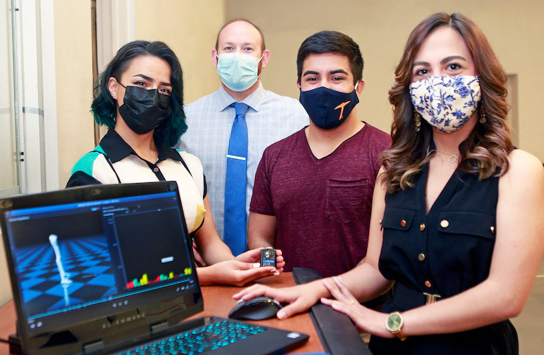 UTEP assistant professor of kinesiology Jeffrey Eggleston, Ph.D., second from left, and research assistants Emily A. Chavez, far left, and Alyssa N. Olivas, far right, use real-time 3D animation to study motor impairments in children with autism. They are joined by Uriel Cabanillas, second from right, a kinesiology graduate student. Photo: Laura Trejo / UTEP Communications 