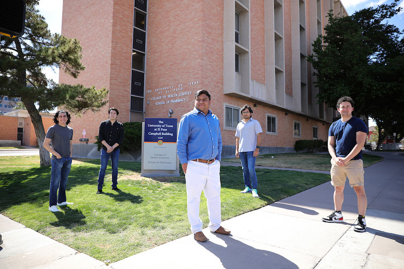 Suman Sirimulla, Ph.D., UTEP assistant professor of pharmaceutical sciences, center, supervised a team of UTEP students who collaborated on a study with the University of New Mexico to develop REDIAL-2020. He is joined by UTEP students Hernan Garcia, left foreground, Julio Franco, left background, Md Mahmudulla Hassan, right background, and Jesus David Garcia, right foreground. Photo by JR Hernandez, UTEP Communications. 