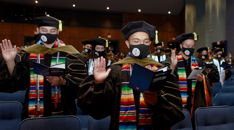 Students in The University of Texas at El Paso's first graduating class from the School of Pharmacy take the oath of a pharmacist during the Pharmacy hooding ceremony May 13, 2021. UTEP will award its first Doctor of Pharmacy (Pharm.D.) degrees to 40 graduates at the University's Spring 2021 Commencement ceremony May 15, 2021, at Sun Bowl Stadium. Photo: Laura Trejo / UTEP Communications 