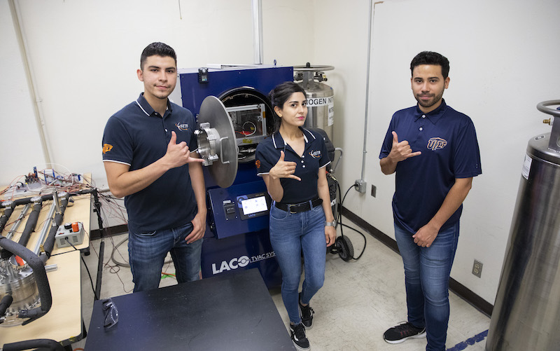 The University of Texas at El Paso is one of six universities to receive the inaugural NASA Lunar Surface Technology Research (LuSTR) $2 million grant to develop technologies to mine ice on the moon for future deep space exploration. Students involved in the research effort, which is led by Ahsan Choudhuri, Ph.D., director of UTEP's Aerospace Center, include, from left, Emmanuel Negron-Ortiz, undergraduate research assistant; Priscilla Mendoza, graduate research assistant; and Nathaniel Jurado, graduate research assistant. Photo: Ivan Pierre Aguirre / UTEP Communications 