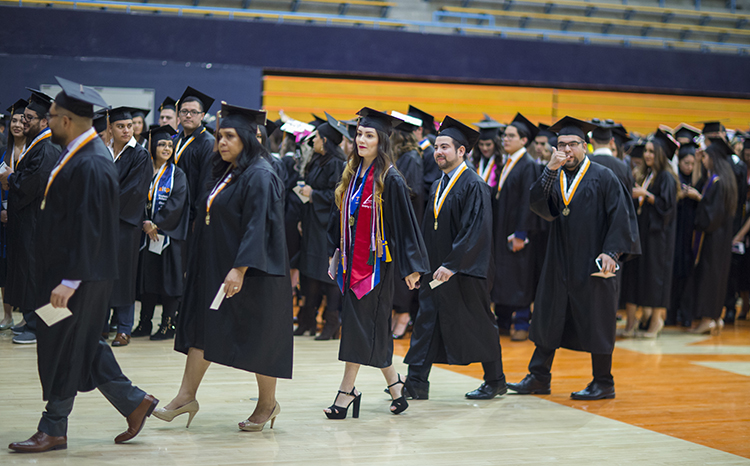 Students line up in Memorial Gym before walking to the Don Haskins Center to celebrate Winter Commencement on Dec. 15, 2018. Faculty, staff and students put in hundreds of hours from the initial planning sessions to rehearsals to make sure the event is as special and memorable as possible for each graduate. 