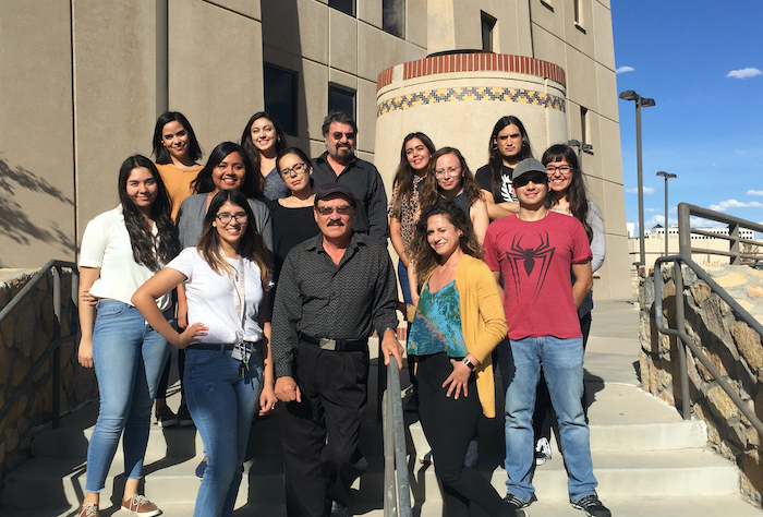 Students and staff in The University of Texas at El Paso's Border Biomedical Research Center (BBRC) stand with Renato Aguilera, Ph.D., foreground center, professor of biological sciences and director of the Biology Graduate Program, and deputy director of the BBRC, in this 2019 photo. Some of the studentsare members of the Research Initiative for Scientific Enhancement (RISE) Program. The RISE program utilizes 21st century technology to promote biomedical research on the border that includes anti-cancer drug discovery, vaccine development against infectious agents, drug addiction, health disparities, and other basic research. Photo: Courtesy.  