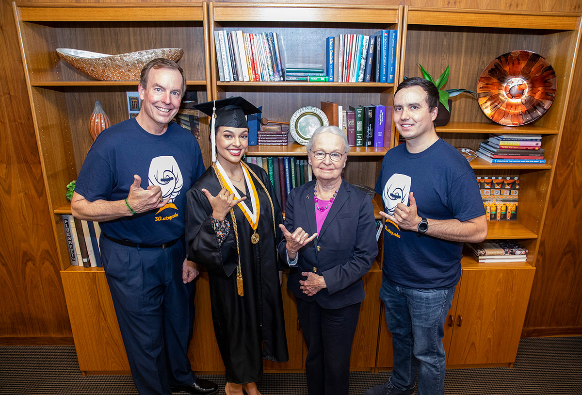 Wallace Hardgrove (left), graduated from UTEP with a accounting bachelor's degree in December 1988 and shook the hand of the UTEP President Diana Natalicio, who took office the previous February. Hardgrove's daughter, Nichole (second from left), will walk the stage during Spring 2019 Commencement, President Natalicio's last commencement. His son, Joshua (right), earned his bachelor's degree in biochemistry during the Centennial Commencement in 2014 in Sun Bowl Stadium. Photo: Ivan Pierre Aguirre / UTEP Communications 