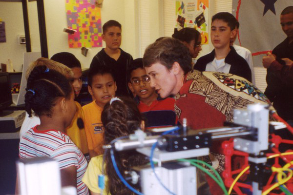 Dr. Heather Wilson interacts with children.