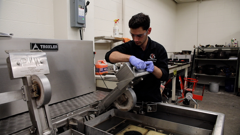 The University of Texas at El Paso is one of four universities to partner with Utah State University to develop an international research center dedicated to advancing sustainable, electrified transportation. The ASPIRE (Advancing Sustainability through Powered Infrastructure for Roadway Electrification) Engineering Research Center was made possible through a grant awarded by the National Science Foundation. College of Engineering student Enrique Saenz is pictured here working in UTEP's asphalt laboratory. Photo: Anais Acosta / College of Engineering 