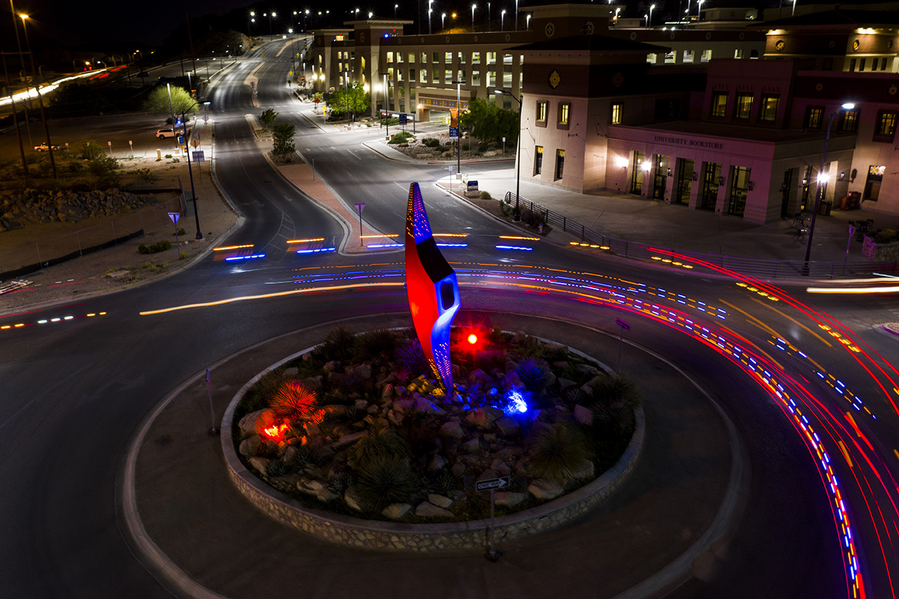 The 'Mining Minds' pickaxe sculpture at The University of Texas at El Paso's University Avenue roundabout will be illuminated in blue and orange from Wednesday evening, May 15, through Sunday evening, May 19, to commemorate UTEP's Class of 2019. Photo: UTEP Communications 