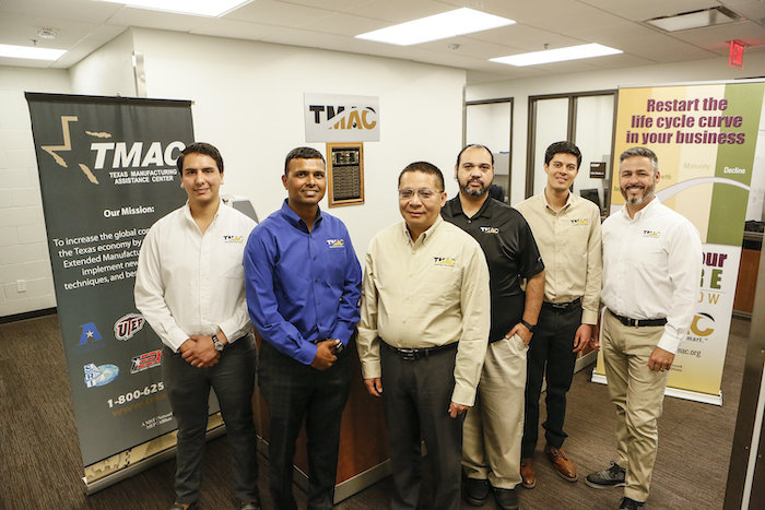 The Texas Manufacturing Assistance Center (TMAC) at The University of Texas at El Paso is helping organizations and businesses nationwide connect with manufacturers to acquire critical personal protective equipment (PPE) needed in the fight against COVID-19. In this 2019 photo, UTEP faculty members from UTEP's Department of Industrial, Manufacturing and Systems Engineering — including Amit Lopes, Ph.D., second from left, assistant professor, and Tzu-Liang (Bill) Tseng, Ph.D., third from left, professor and chair of IMSE — stand with other TMAC members at the organizations UTEP offices. Photo: J.R. Hernandez / UTEP Communications 