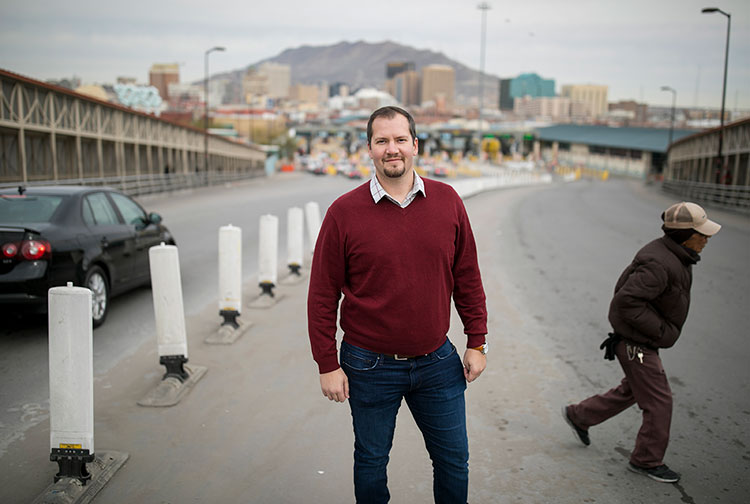 Jeremy Slack, Ph.D., assistant professor of geography at UTEP, stands at the Paso Del Norte International Bridge. His Immigration and Border Community - Research Experience for Undergraduates (IBCREU) program focused on asylum hearings, migrant family separations and research into zero tolerance policies when the U.S. government opened its shelter for unaccompanied or separated migrant children in Tornillo, Texas, last summer. Photo by Ivan Pierre Aguirre / UTEP Communications 