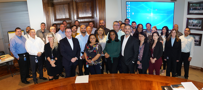 Faculty and staff from UTEP's Texas Manufacturing Assistance Center (TMAC) stand with employees of the Marvin Group, an engineering firm in Inglewood, California, in this October 2019 photo. TMAC has worked with the Marvin Group and other companies nationwide in an effort to realign their supply efforts to assist health care providers during the COVID-19 outbreak. Photo: Courtesy 